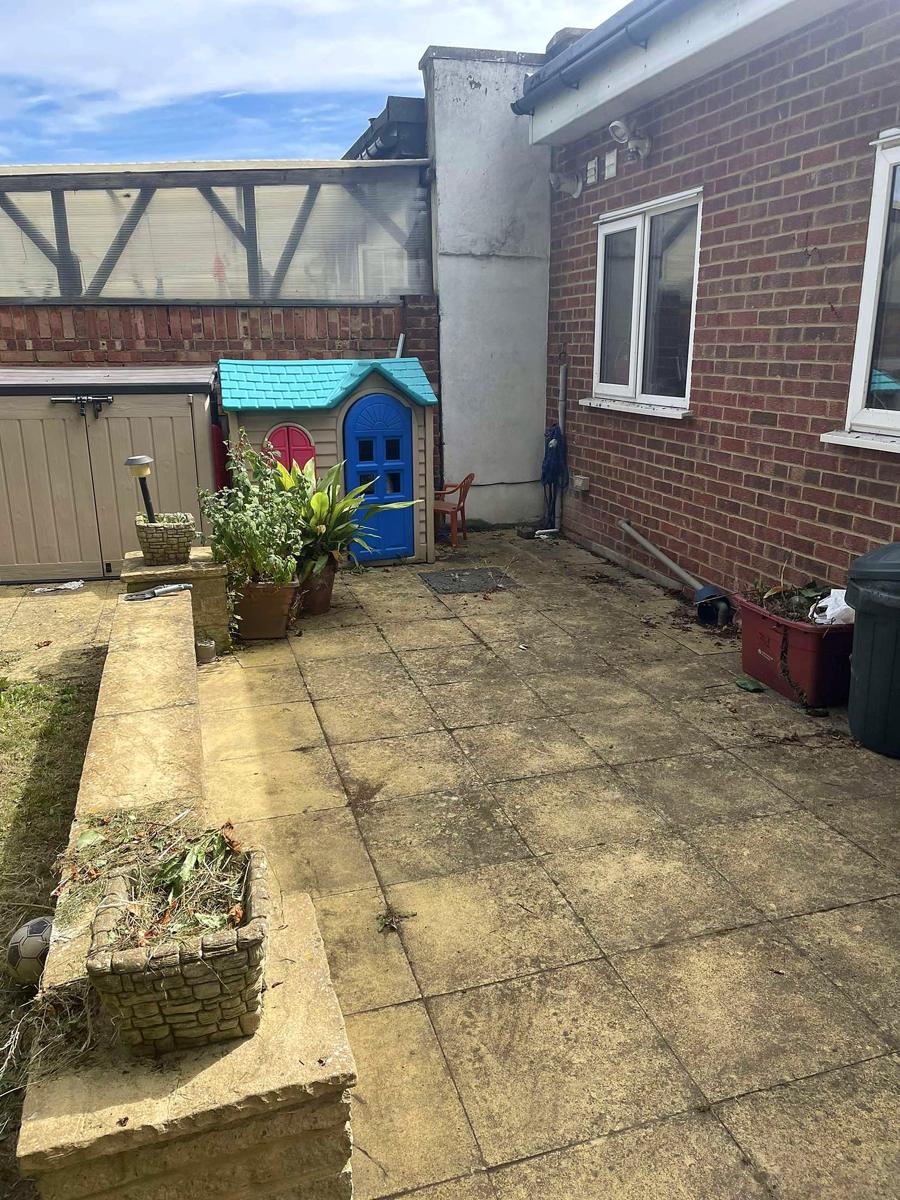 Patio swept beside the house